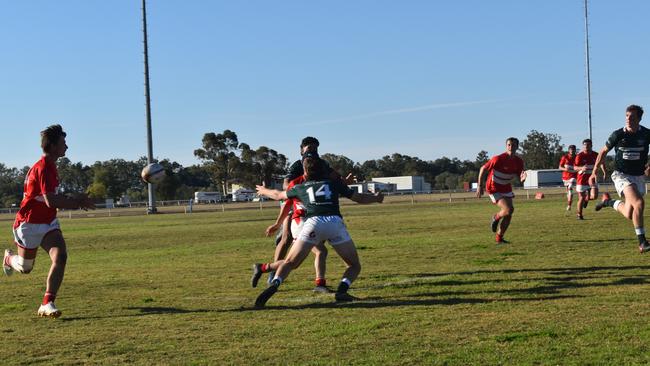 Spectators cheer on as they watch the B Grade St George vs Condamine match at the Roma Rugby Races at Bassett Park. Picture: Chloe Cufflin.