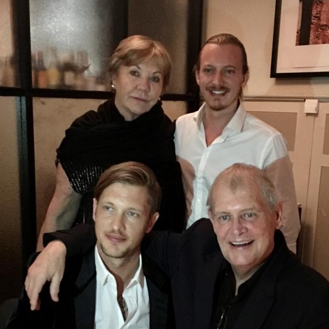 The Farnham family, clockwise from bottom left: Rob, Jill, James and John.