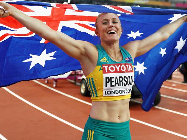 LONDON, ENGLAND - AUGUST 12:  Sally Pearson of Australia celebrates with an Australian flag after winning gold in the Women's 100 metres hurdles final during day nine of the 16th IAAF World Athletics Championships London 2017 at The London Stadium on August 12, 2017 in London, United Kingdom.  (Photo by Patrick Smith/Getty Images)