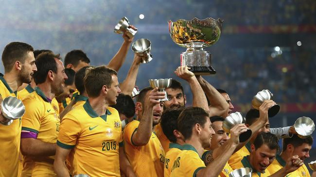 SYDNEY, AUSTRALIA - JANUARY 31: Mile Jedinak of Australia lifts the trophy during the 2015 Asian Cup final match between Korea Republic and the Australian Socceroos at ANZ Stadium on January 31, 2015 in Sydney, Australia. (Photo by Ryan Pierse/Getty Images)