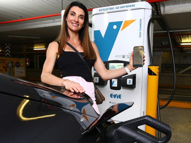 EV driver Michelle Ryan, Director of Bespoke Money Mortgage Broking, charging her vehicle at the Evie Network Charging station inside Indooroopilly shopping centre. Wednesday 25th October 2023 David Clark