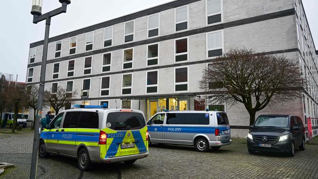 Police vehicles the Higher Administrative Court in Muenster, Germany. Picture: AFP.