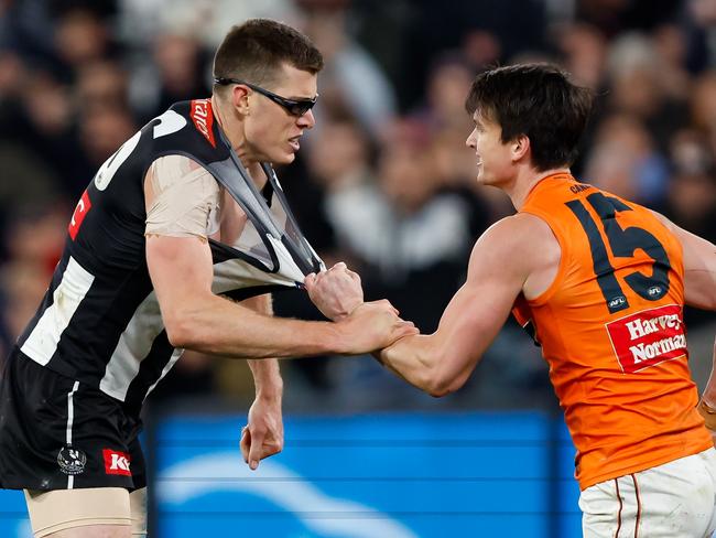 MELBOURNE, AUSTRALIA - SEPTEMBER 22: Mason Cox of the Magpies engages with Sam Taylor of the Giants after a goal during the 2023 AFL First Preliminary Final match between the Collingwood Magpies and the GWS GIANTS at Melbourne Cricket Ground on September 22, 2023 in Melbourne, Australia. (Photo by Dylan Burns/AFL Photos via Getty Images)