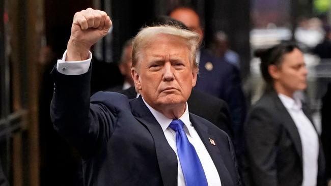 Mr Trump holds up a fist as he arrives back at Trump Tower after being convicted. Picture: TIMOTHY A. CLARY / AFP