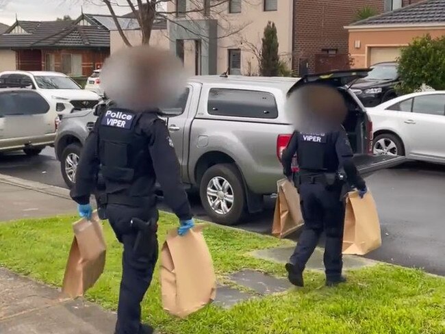 Police remove evidence after arresting Mr Al Qassim. Picture: Victoria Police