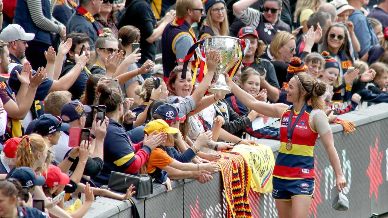 Jenna McCormick of the crows celebrates with fans during the AFLW grand final match between the Adelaide Crows and the Carlton Blues at Adelaide Oval in Adelaide, Sunday, March 31, 2019. (AAP Image/Kelly Barnes) NO ARCHIVING, EDITORIAL USE ONLY. Picture: KELLY BARNES