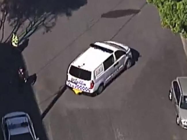 Police vehicles outside the residence in Wynnum where a man's body was found on Wednesday. He was aged in his 40s. Picture: Seven News