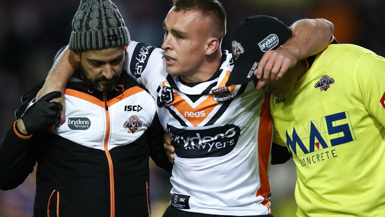 Jacob Liddle is helped from the field after sustaining a knee injury in 2019. Picture: AAP Image/Brendon Thorne