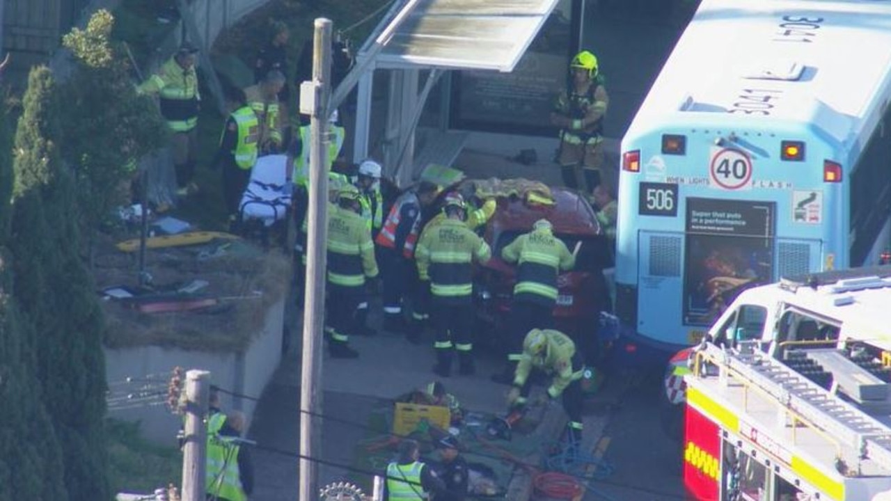 Specialist rescue crews managed to remove one trapped in her car, after it crashed into a bus stop in Drummoyne on Tuesday morning. Picture: Supplied / Channel 9