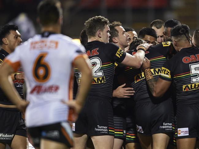 SYDNEY, AUSTRALIA - AUGUST 29: Jarome Luai of the Panthers is congratulated by team mates after scoring a try during the round 16 NRL match between the Panthers and the Wests Tigers at Panthers Stadium on August 29, 2020 in Penrith, Australia. (Photo by Brett Hemmings/Getty Images)