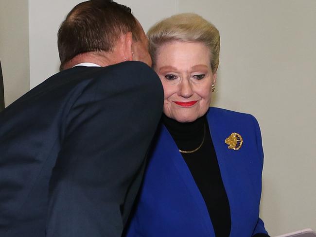 Tony Abbott kisses Bronwyn Bishop after the party room meeting to elect a new speaker at Parliament House in Canberra. Picture: Kym Smith