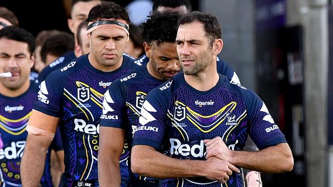 Cameron Smith leads his Melbourne Storm team onto the field to face Newcastle Knights on Sunday. Picture: Getty Images