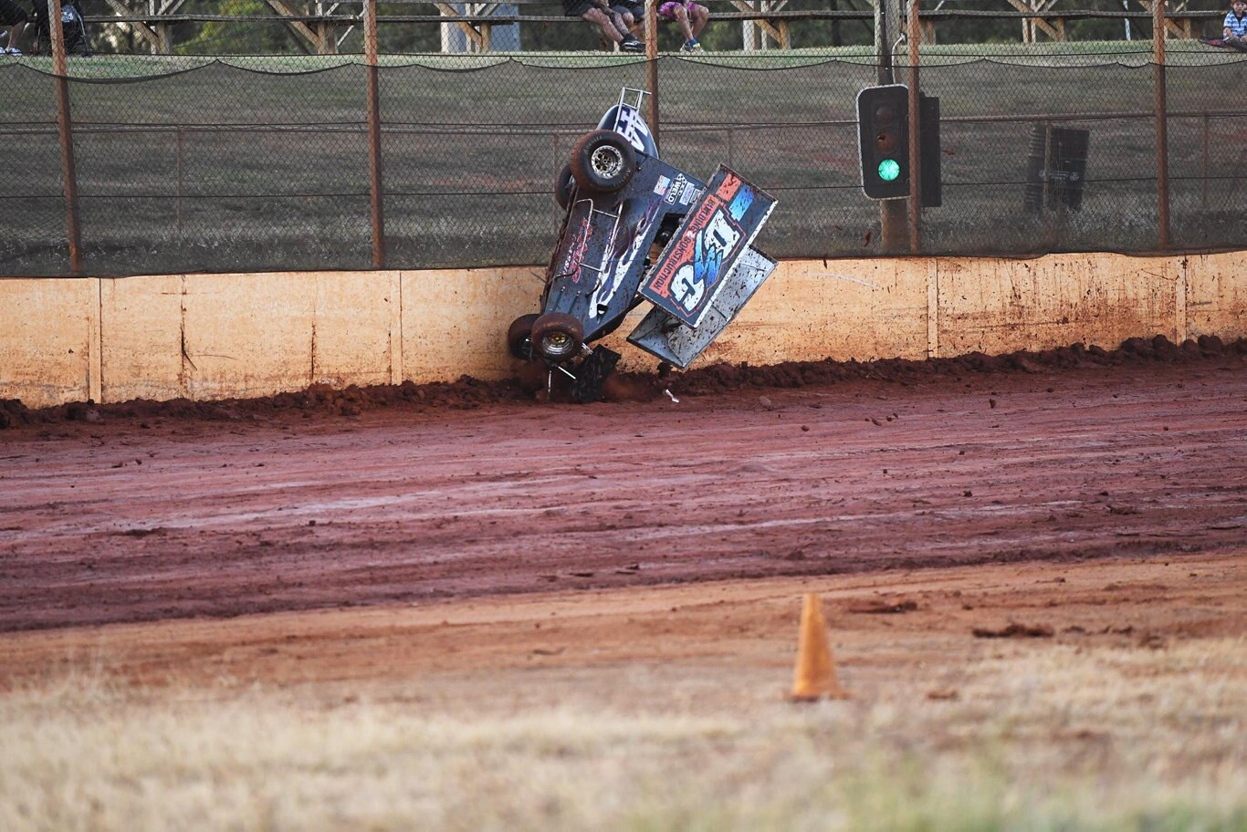 Maryborough Speedway Round One - Ken Newton climbs the wall after losing control on the slippery track. Picture: Cody Fox