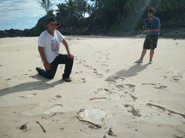 Blaine Alan Gibson with a piece of MH370 debris found on Riake Beach, Madagascar. Picture: Facebook