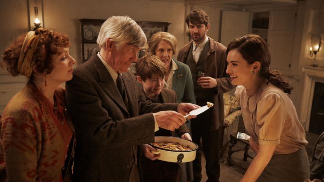 Katherine Parkinson, Tom Courtenay, Kit Connor, Penelope Wilton, Michiel Huisman and Lily James in The Guernesy Literary And Potato Peel Pie Society.
