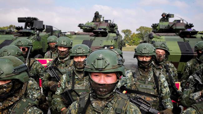 Taiwanese soldiers show their combat skills during a visit by Taiwan president Tsai Ing-wen at a military base on January 6. Picture: by Sam Yeh / AFP