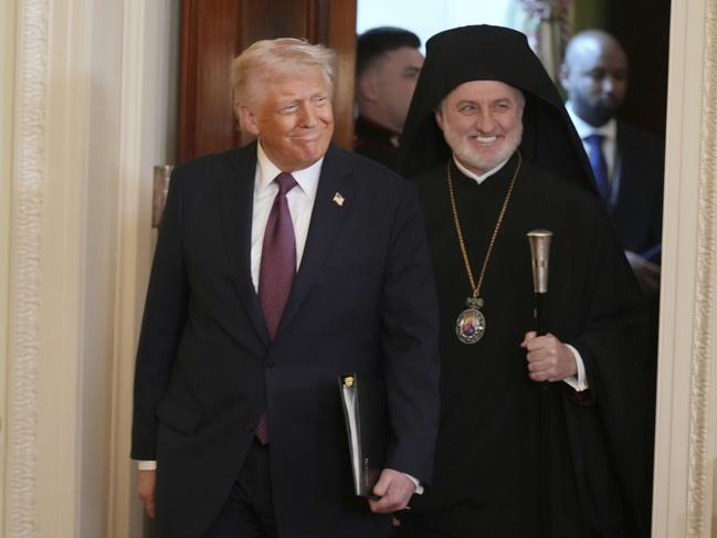 President Donald Trump, left, and Archbishop Elpidophoros of the Greek Orthodox Archdiocese of America. Picture: AP Photo.