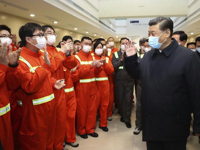 Chinese President Xi Jinping visits the Chuanshan port area of the Ningbo-Zhoushan Port in east China's Zhejiang Province. Authorities in China are working to restart its industries as number of new coronavirus cases and deaths fall in the country. Picture: AP