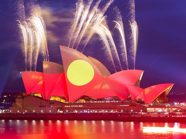 This picture shows the Opera House illuminated in the colours of the Aboriginal flag in Sydney on Australia Day on January 26, 2023. (Photo by Robert Wallace / AFP)