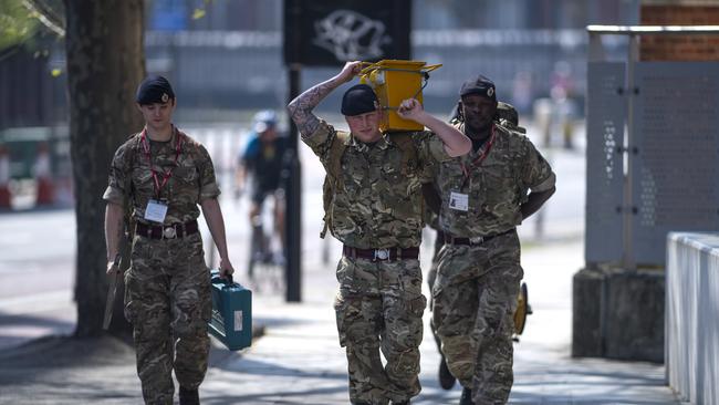 Military personnel are seen outside St Thomas' Hospital. where UK Prime Minister Boris Johnson is recovering.