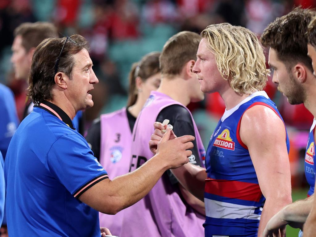 Bulldogs coach Luke Beveridge speaks to Cody Weightman during the huddle of a game in 2023. Picture: Matt King/AFL Photos/via Getty Images.