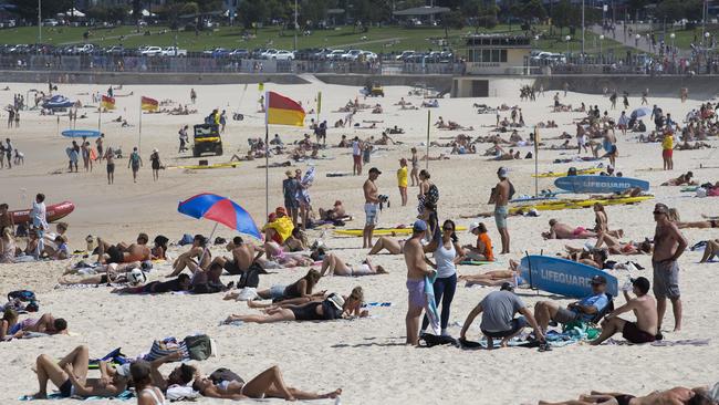 Crowds at Bondi in early march drew ire, and forced first the cclosure of the beach, then the introuction of a 500 person limit. Picture: Brendan Read