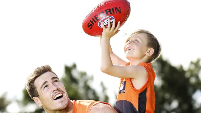 Greater Western Sydney Giants Jeremy Cameron and supporter Lincoln Summons, 8, at Kellyville today. Lincoln really took to Jeremy and vice versa after meeting him at a junior club visit a couple of years ago. They both made time to catch up whenever possible with Jeremy eventually going to Lincoln's year two class as his show and tell. Picture: Justin Lloyd