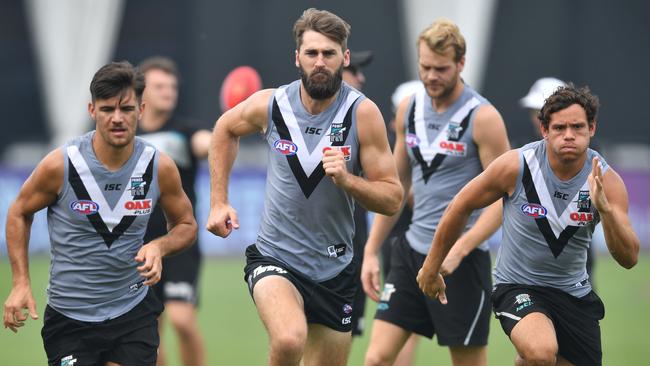 Port Power players Riley Bonner, Justin Westhoff and Steven Motlop during Friday’s training session at the Adelaide Arena at Jiangwan Stadium in Shanghai, China. Picture: AAP Image/David Mariuz