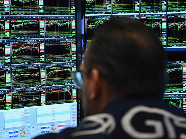 Traders work the floor during morning trading at the New York Stock exchange (NYSE) ahead of the US Federal Reserve's decision on lending rates, in New York on January 31, 2024. (Photo by ANGELA WEISS / AFP)