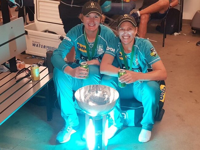 Dolphins pair Sammy-Jo Johnson and Kimmince toast the Brisbane Heat’s WBBL triumph last season. Picture: SUPPLIED