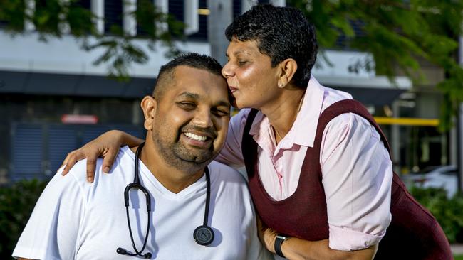 Dr Dinesh Palipana receives a congratulatory kiss from mother Anne after receiving a job offer from Gold Coast University Hospital. Photo: Jerad Williams.