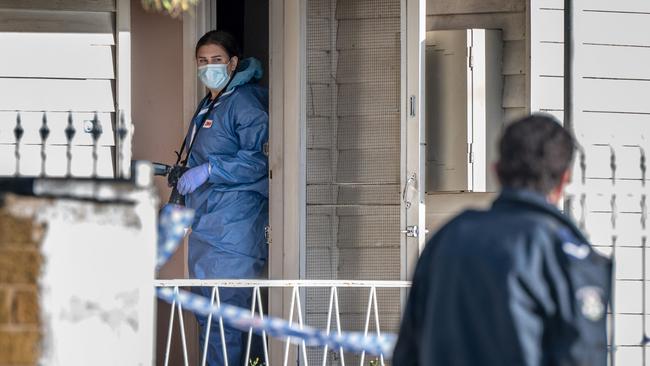 Forensic police scour the scene at Lesley Grove in Noble Park. Picture: Tony Gough