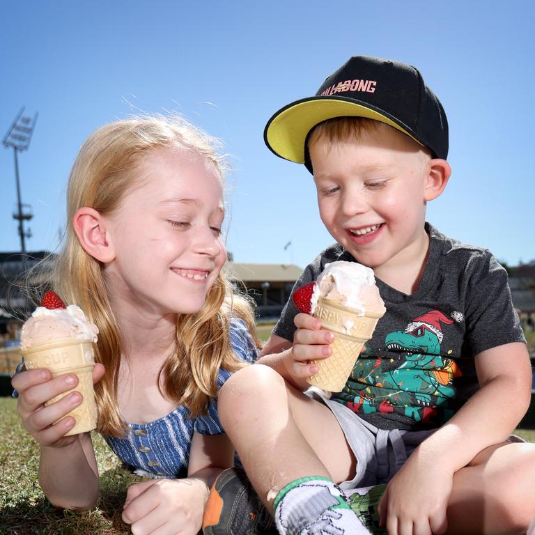 Kate Schipper 7 yrs Caleb Schipper 4 yrs, from Bellbird Park, eating Strawberry Sundaes on the hill. Photo Steve Pohlner