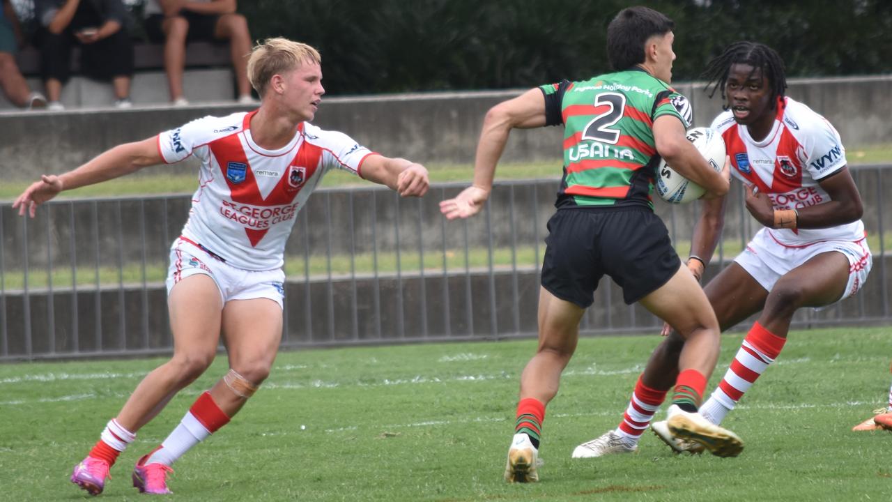 Jacob Fong tries to evade Charlie Boyle (left) and Volonte Baruani. Picture: Sean Teuma