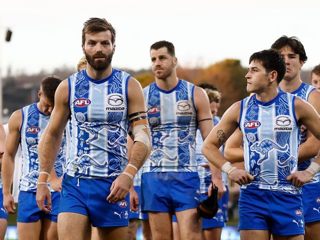 Luke McDonald and the Roos walk off after their loss to Port Adelaide in Hobart. Picture: Michael Willson/AFL Photos via Getty Images.