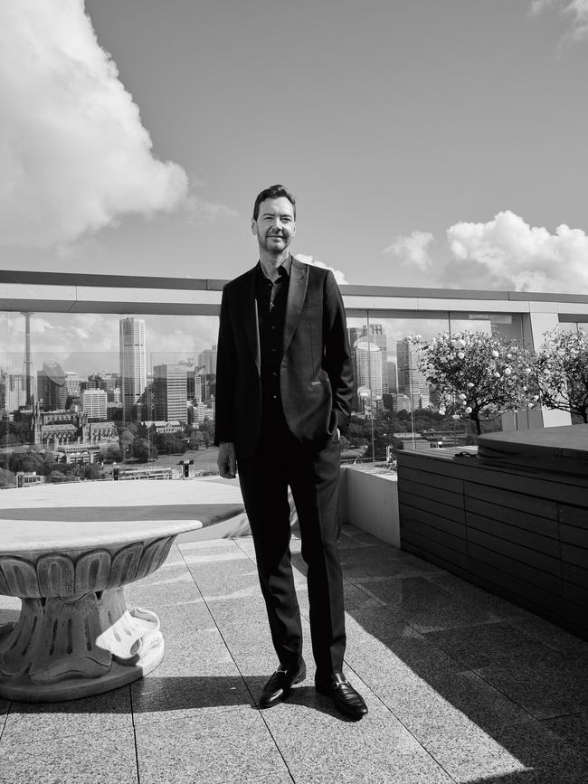 Schuman on his terrace overlooking the Sydney skyline. Picture: Nic Walker