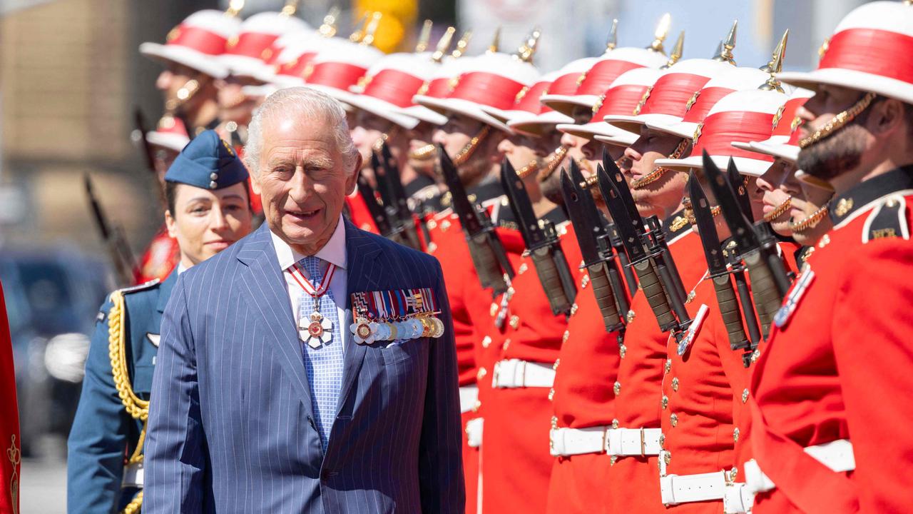 King Charles III inspects an honour guard at the Senate of Canada Courtyard in Ottawa, Canada, May 27, 2025. King Charles III was given an enthusiastic welcome on May 26 by Canadians who turned out in droves to see their monarch on his historic visit to open parliament, as part of the push back against US President Donald Trump. Picture: AFP