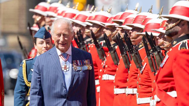 King Charles III inspects an honour guard at the Senate of Canada Courtyard in Ottawa, Canada, May 27, 2025. King Charles III was given an enthusiastic welcome on May 26 by Canadians who turned out in droves to see their monarch on his historic visit to open parliament, as part of the push back against US President Donald Trump. Picture: AFP