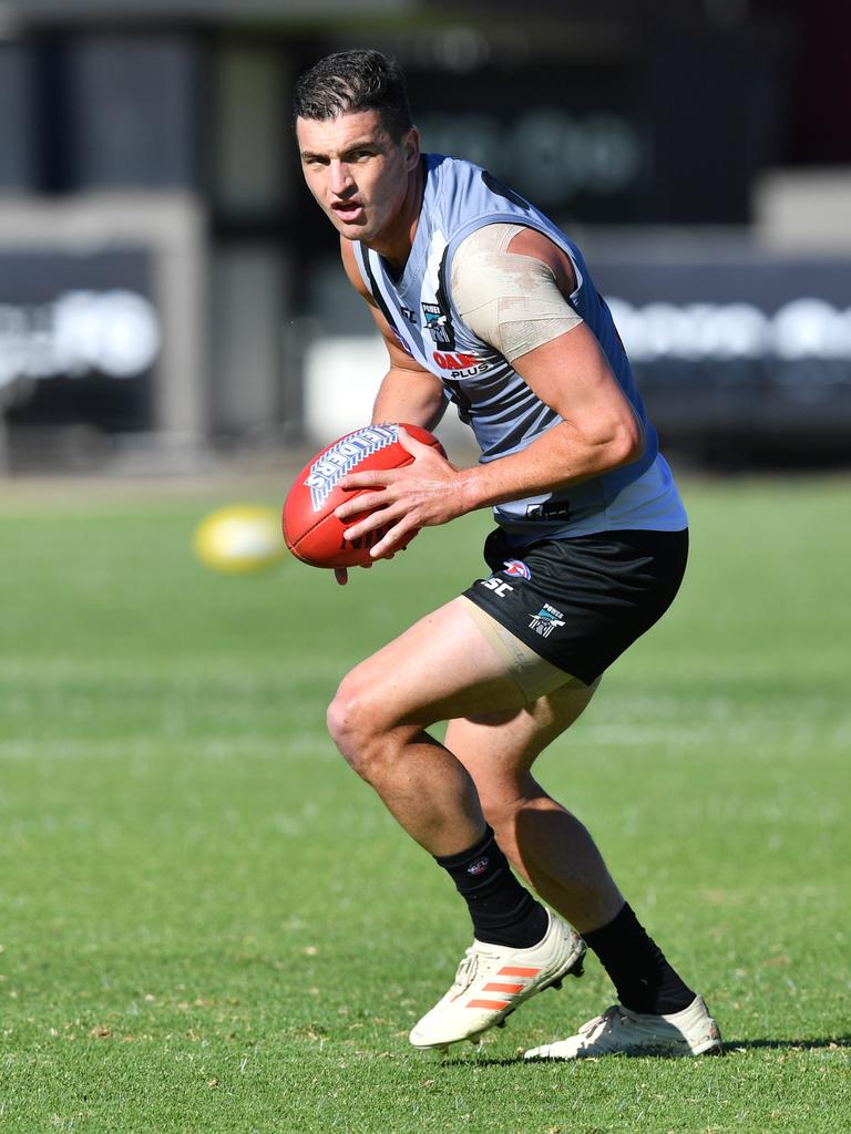 Tom Rockliff trains at Alberton on Tuesday. Picture: AAP Image/David Mariuz