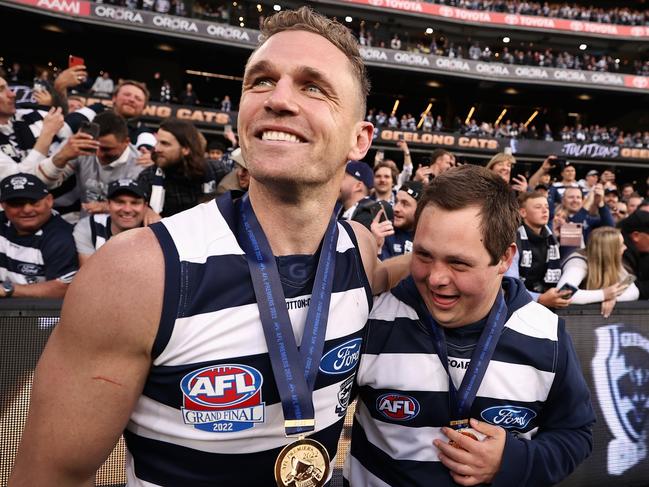 MELBOURNE, AUSTRALIA - SEPTEMBER 24: Joel Selwood of the Cats celebrates with Cats head waterboy Sam Moorfoot after winning the 2022 AFL Grand Final match between the Geelong Cats and the Sydney Swans at the Melbourne Cricket Ground on September 24, 2022 in Melbourne, Australia. (Photo by Cameron Spencer/AFL Photos/via Getty Images)