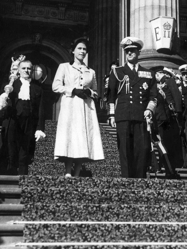 Queen Elizabeth and the Duke of Edinburgh on the steps of Parliament during their visit to Melbourne in 1954. Picture: HWT Library.