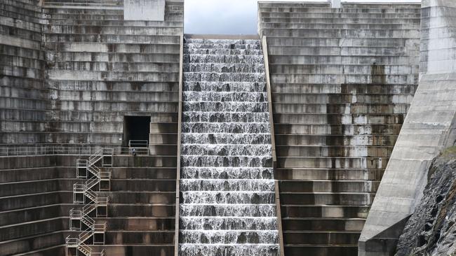 Water spilling over the Hinze Dam. Picture Glenn Hampson