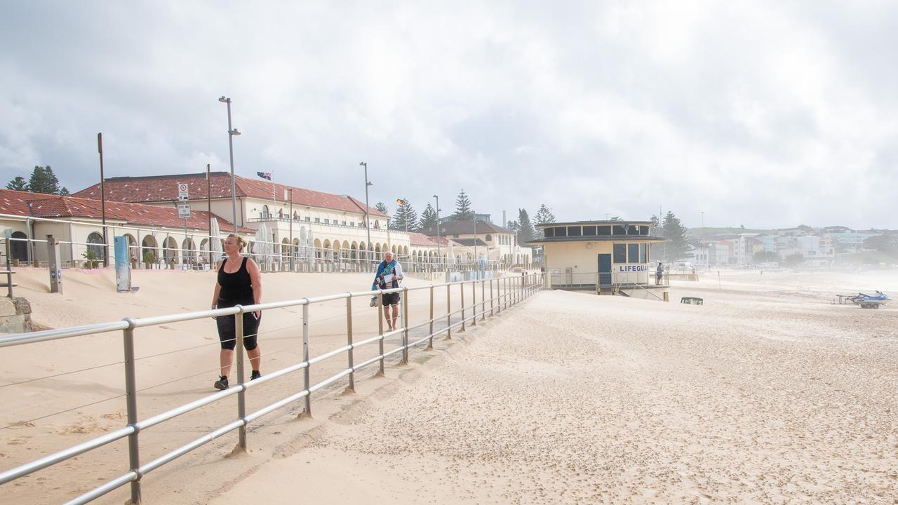 The scene at Bondi Pavillion on Saturday after heavy winds swept sand across walking paths. Picture Thomas Lisson