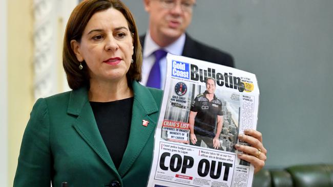 Opposition Leader Deb Frecklington during Question Time with a copy of the Bulletin. (AAP Image/Darren England)