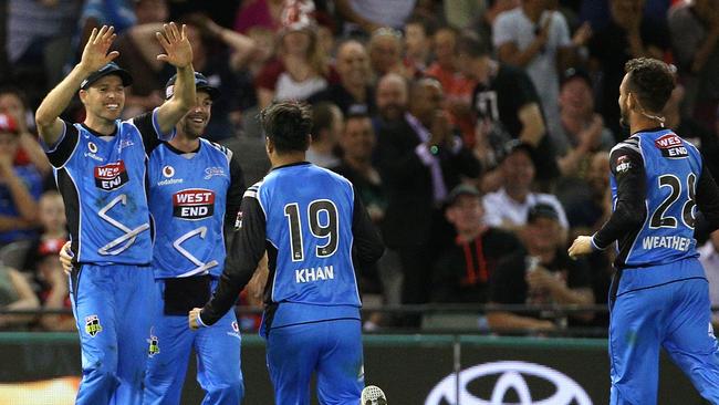 Laughlin (left) is swamped as Weatherald (right) and the Strikers celebrate. Pic: AAP