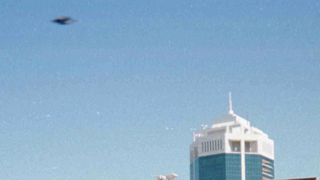 23 September 1998: Picture of an alleged Flying Saucer (UFO) over Dolphin Arcade building at Surfers Paradise Gold Coast taken by Oswald Raeder with a disposable camera.