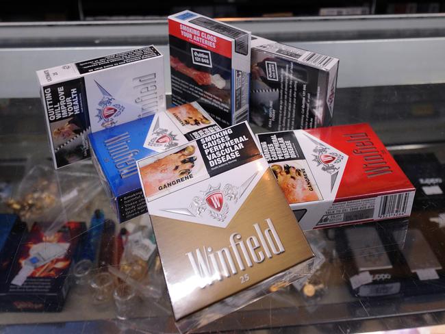 Generic image of branded cigarette packets at a tobacconist shop, Wednesday, Aug. 4, 2010.  Anti-smoking group Quit today has slammed an advertising campaign which will soon call for cigarettes to remain in clearly branded packets.  (AAP Image/ Joe Castro) NO ARCHIVING
