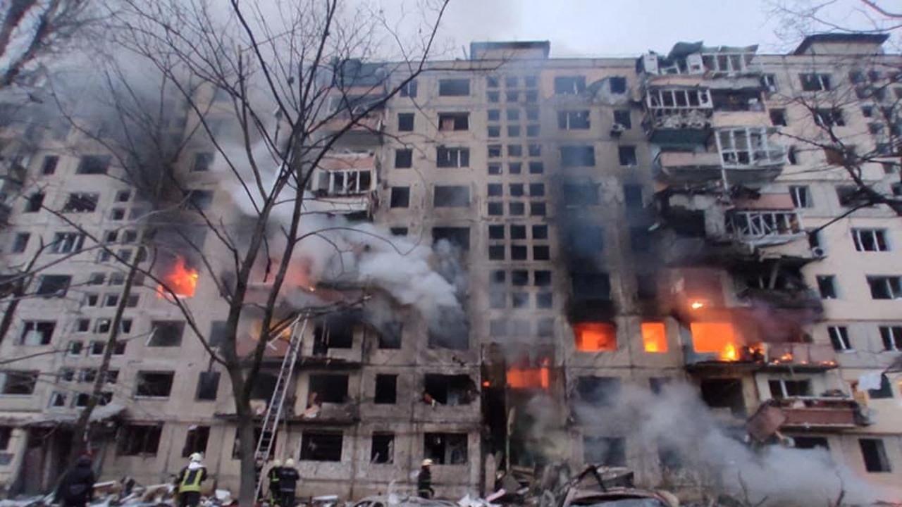 Rescuers work next to a residential building damaged by shelling, as Russia's attack on Ukraine continues, in Kyiv, Ukraine. Picture: Reuters