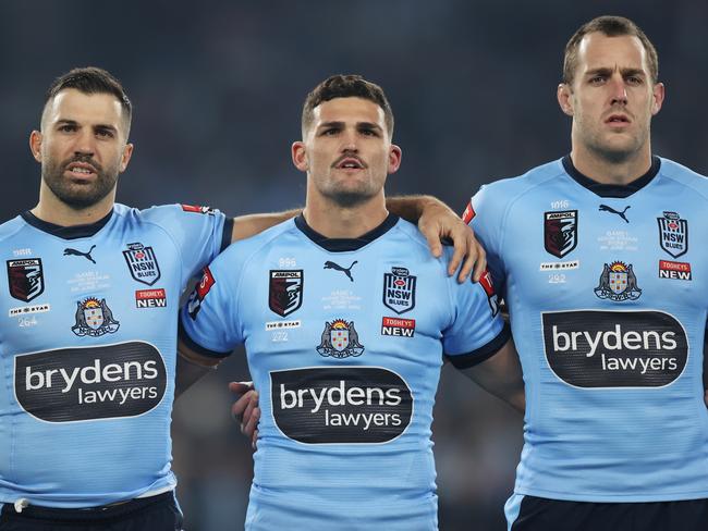 SYDNEY, AUSTRALIA - JUNE 08:  (L-R) James Tedesco, Nathan Cleary and Isaah Yeo of the Blues line up for the national anthem during game one of the 2022 State of Origin series between the New South Wales Blues and the Queensland Maroons at Accor Stadium on June 08, 2022, in Sydney, Australia. (Photo by Mark Kolbe/Getty Images)