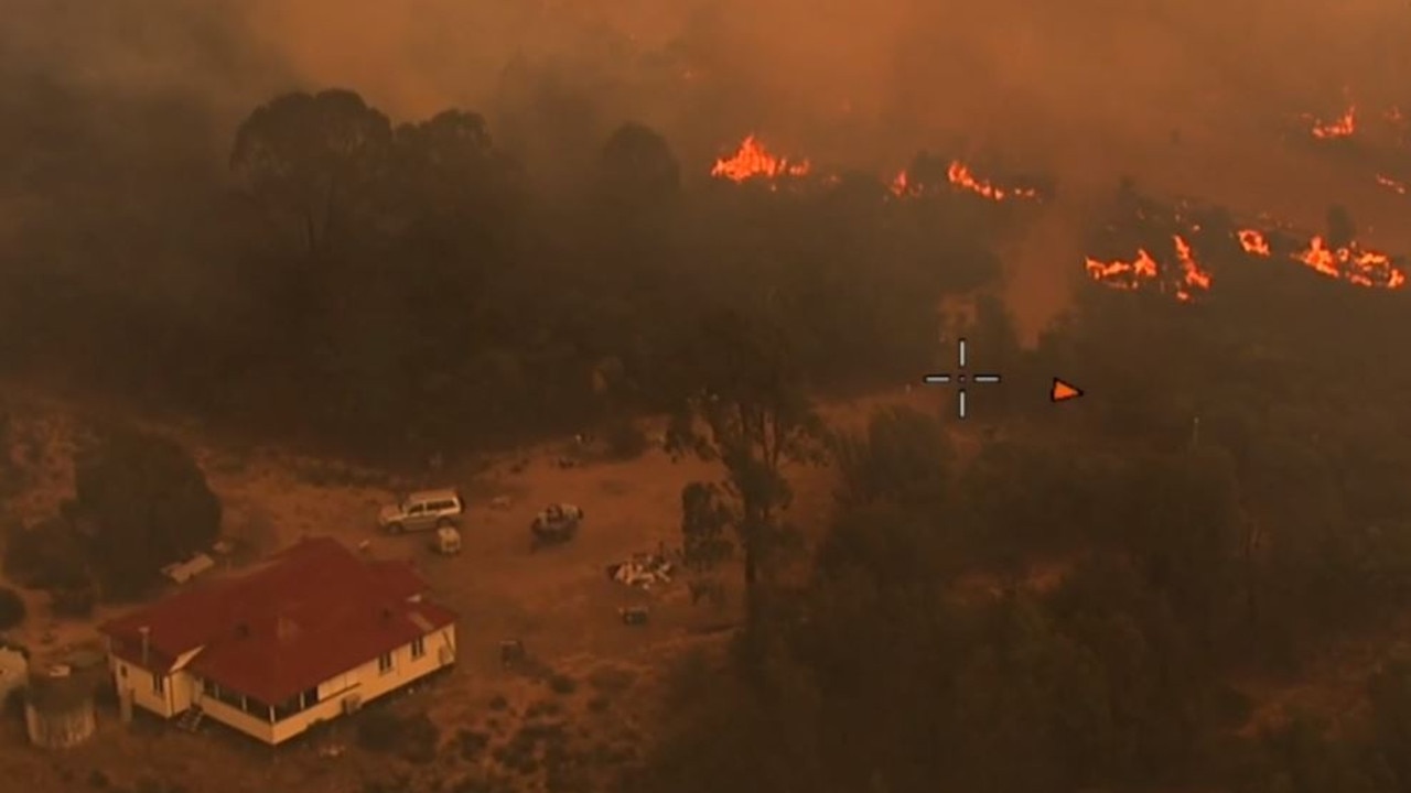 Fire threatens a home at Tara on Tuesday. Source: QFES